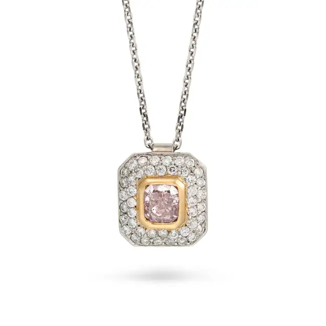 A FANCY GRAYISH PINK-PURPLE DIAMOND PENDANT NECKLACE in platinum, the pendant set with a radiant cut