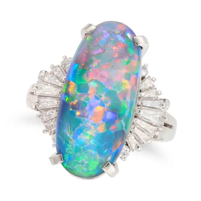 A FINE BLACK OPAL AND DIAMOND RING set with an oval cabochon black opal of 4.92 carats, accented