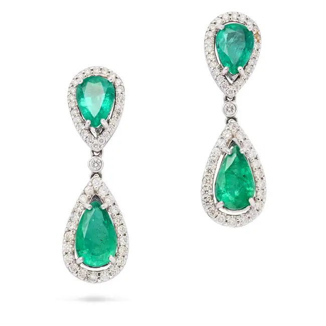 A PAIR OF ZAMBIAN EMERALD AND DIAMOND DROP EARRINGS each comprising a pear cut emerald within a