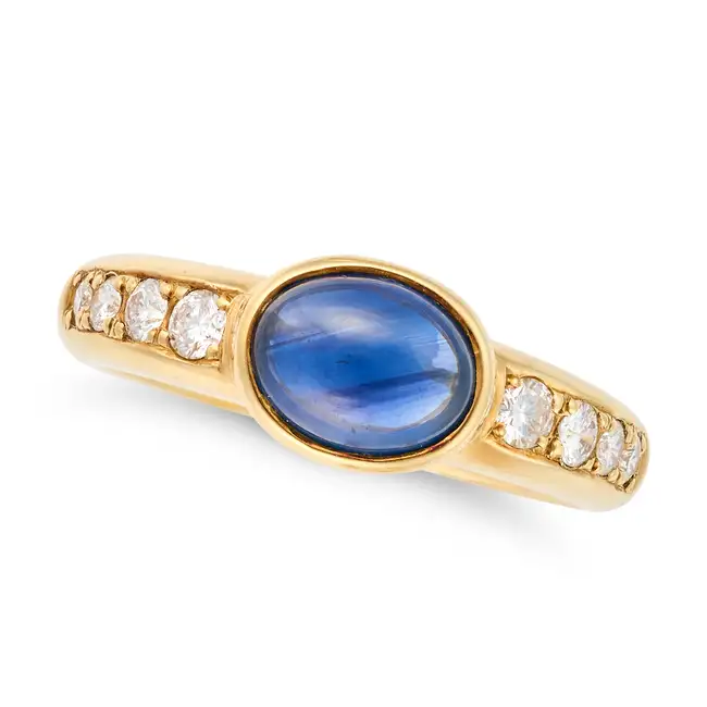 VALENTINO, A SAPPHIRE AND DIAMOND RING set with a cabochon sapphire of 1.86 carats, accented by