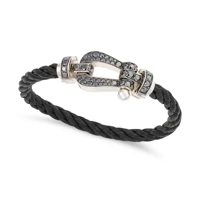 FRED PARIS, A BLACK DIAMOND FORCE 10 BRACELET in 18ct white gold and steel, comprising a buckle