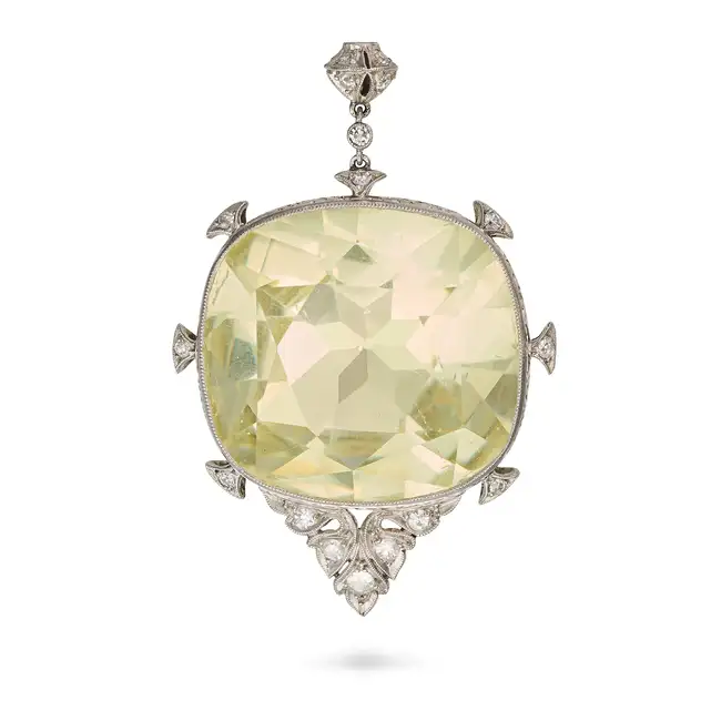 BECHET & BARCLEY, A DIAMOND AND PASTE PENDANT set with a cushion cut yellow paste stone, accented by