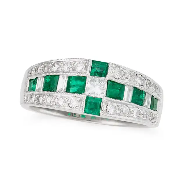 AN EMERALD AND DIAMOND DRESS RING in 18ct white gold, the tapering ring set with square step cut