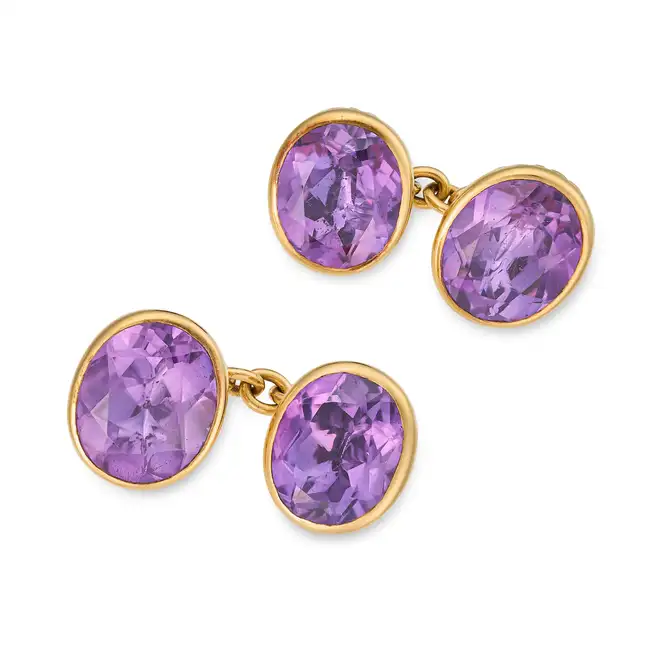 A PAIR OF VINTAGE AMETHYST CUFFLINKS each set with an oval cut amethyst, no assay marks, 1.3cm, 11.