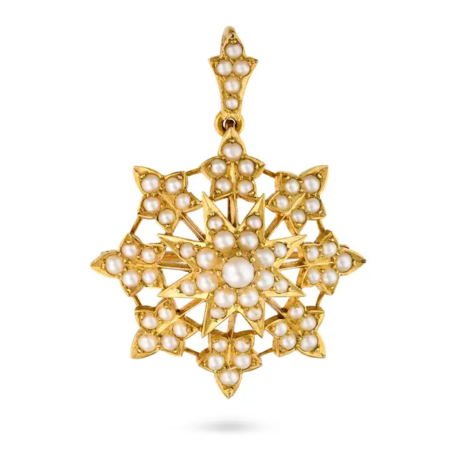 AN ANTIQUE PEARL STARBURST BROOCH / PENDANT in yellow gold, comprising a central star motif set with
