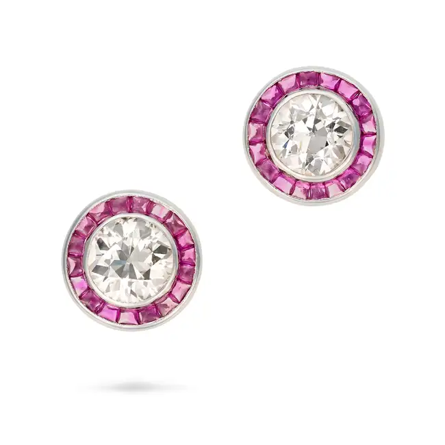 A FINE PAIR OF DIAMOND AND RUBY TARGET STUD EARRINGS each set with an old European cut diamond in