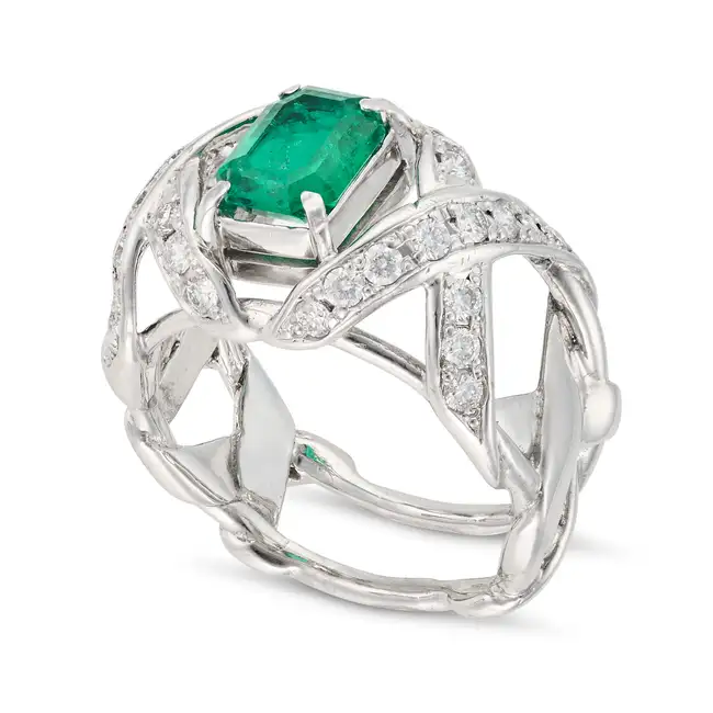 SCHLUMBERGER FOR TIFFANY & CO., AN EMERALD AND DIAMOND RING set with an octagonal step cut emerald