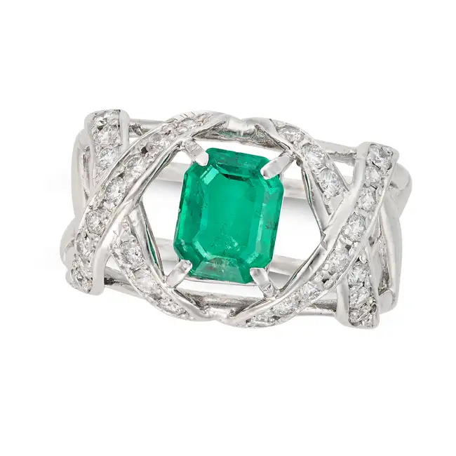 SCHLUMBERGER FOR TIFFANY & CO., AN EMERALD AND DIAMOND RING set with an octagonal step cut emerald