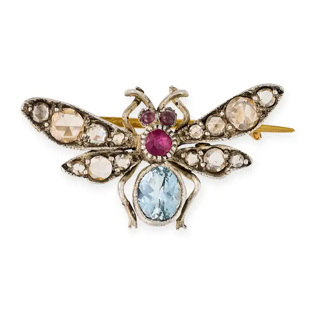AN ANTIQUE AQUAMARINE, RUBY, GARNET AND DIAMOND INSECT BROOCH designed as a winged insect set with
