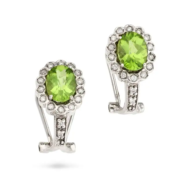 A PERIDOT AND DIAMOND RING AND EARRINGS SUITE the ring set with an oval cut peridot of approximately