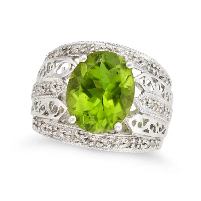 A PERIDOT AND DIAMOND RING AND EARRINGS SUITE the ring set with an oval cut peridot of approximately