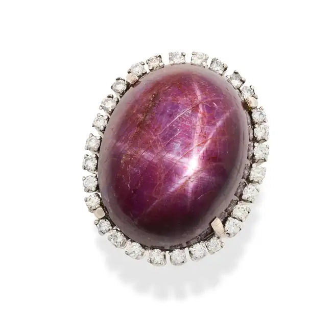 CARTIER, AN IMPRESSIVE 70.86 CARAT STAR RUBY AND DIAMOND RING in platinum, set with a cabochon