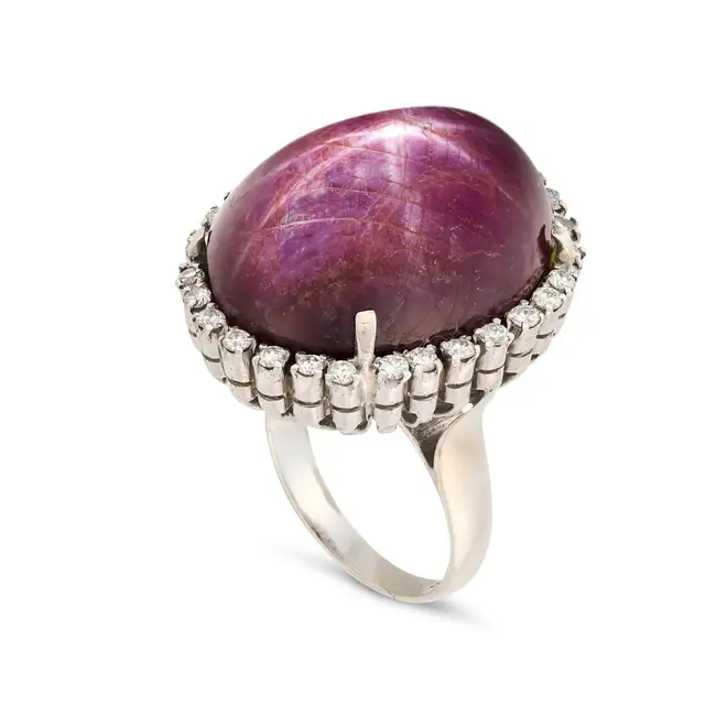 CARTIER, AN IMPRESSIVE 70.86 CARAT STAR RUBY AND DIAMOND RING in platinum, set with a cabochon