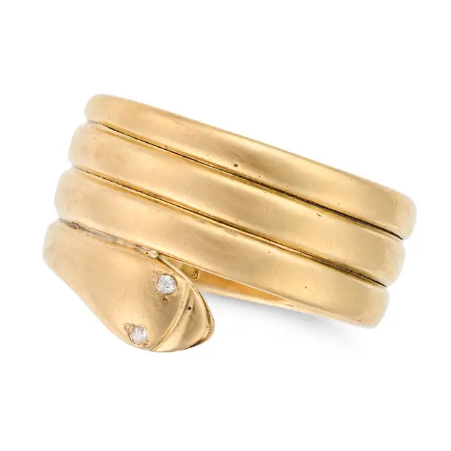 AN ANTIQUE VICTORIAN DIAMOND SNAKE RING, 1898 in 18ct yellow gold, designed as a coiled snake, the