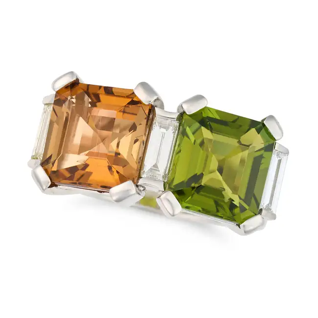 A VINTAGE PERIDOT, TOPAZ AND DIAMOND DRESS RING set with an octagonal step cut orange topaz of