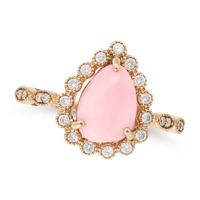 A CONCH PEARL AND DIAMOND RING set with a conch pearl of 2.17 carats in a pear shaped border of