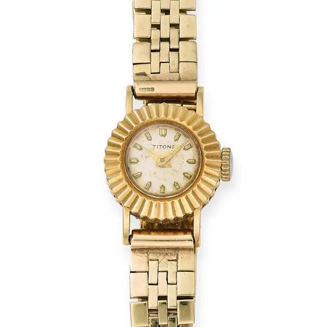 TITONI, A VINTAGE WRISTWATCH in yellow gold, the circular watch face with baton hour markers, on a