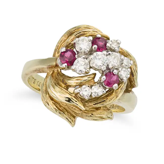 A VINTAGE RUBY AND DIAMOND DRESS RING in 14ct yellow gold, in foliate design, set with a cluster