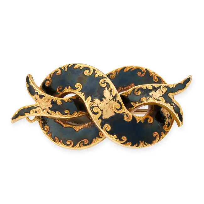 NO RESERVE - AN ANTIQUE VICTORIAN ENAMEL RIBBON MOURNING BROOCH, CIRCA 1844 in yellow gold, designed