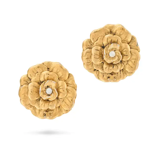 CHANEL, A PAIR OF CAMELLIA CLIP-ON EARRINGS each comprising a gold tone metal earring in the shape