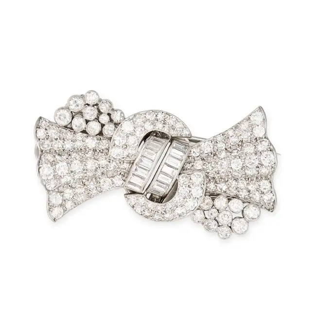LE ROY ET FILS, A DIAMOND DOUBLE CLIP BROOCH, 1930'S designed as a stylised bow set with single