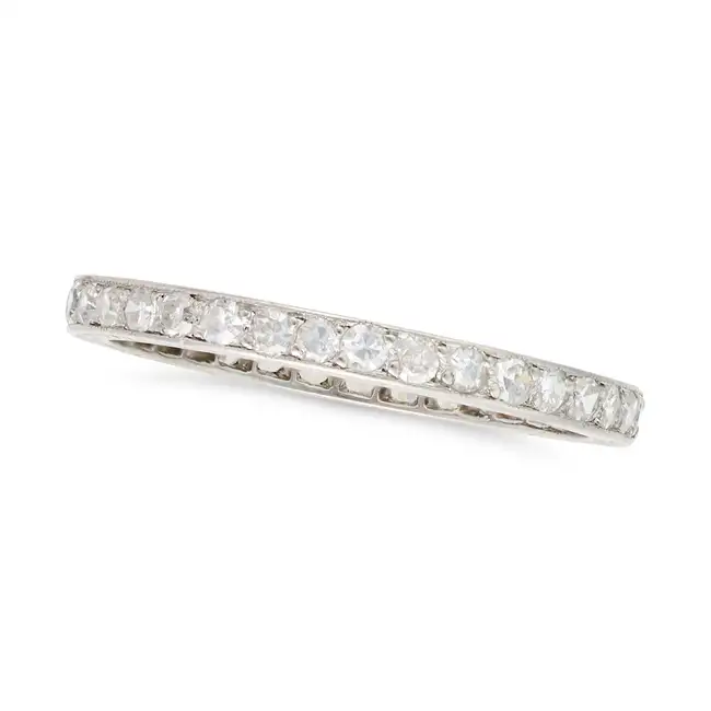 AN ART DECO DIAMOND FULL ETERNITY RING set all around with a row of single cut diamonds, engraved to