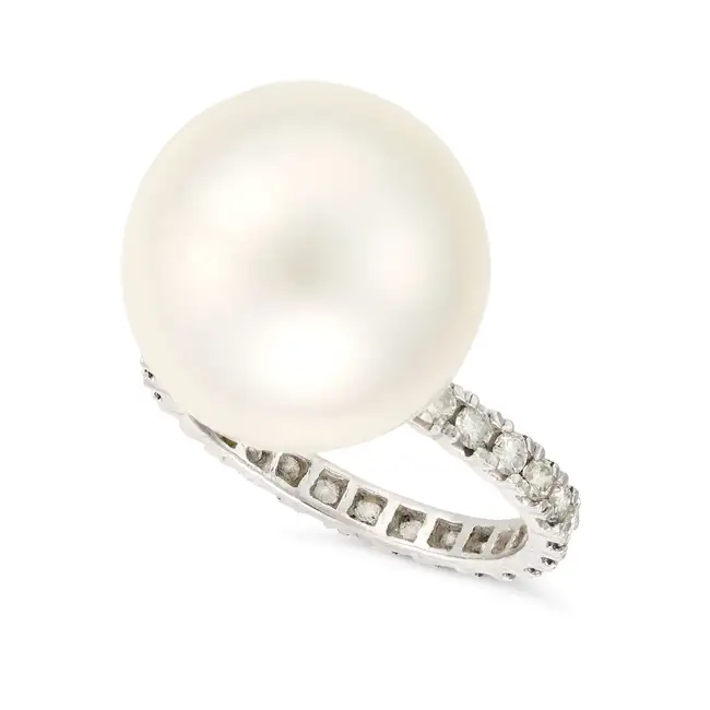 A SOUTH SEA PEARL AND DIAMOND RING set with a South Sea pearl of 16.0mm, the eternity band set all