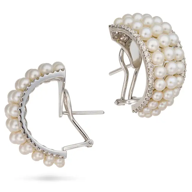 A PAIR OF PEARL AND DIAMOND HOOP EARRINGS each designed as a half hoop set with three graduating