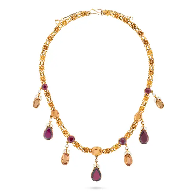 ALFRED PHILIPS, A FINE ANTIQUE IMPERIAL TOPAZ AND GARNET NECKLACE in yellow gold, comprising a row
