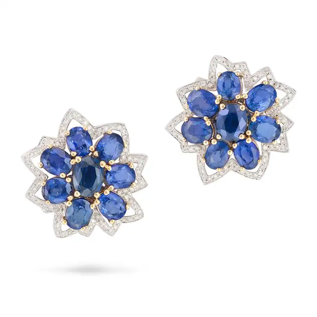 A PAIR OF SAPPHIRE AND DIAMOND FLOWER EARRINGS each designed as a stylised flower, set with a