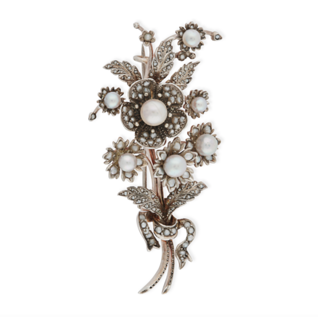 AN ANTIQUE PEARL FLOWER SPRAY BROOCH in silver, designed as a bouquet of flowers tied together with a ribbon, set throughout with pearls, no assay marks, 7.3cm, 23.3g. 