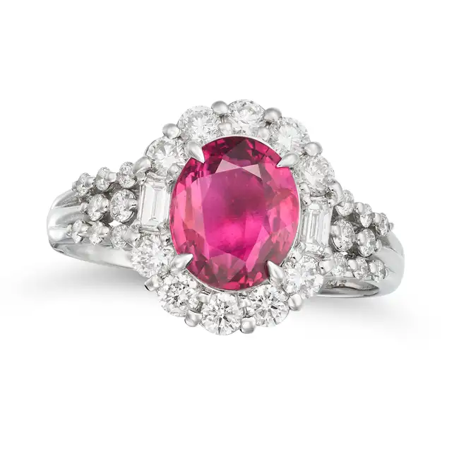 NO RESERVE - A FINE UNHEATED RUBY AND DIAMOND RING set with an oval cut ruby of 2.00 carats in a