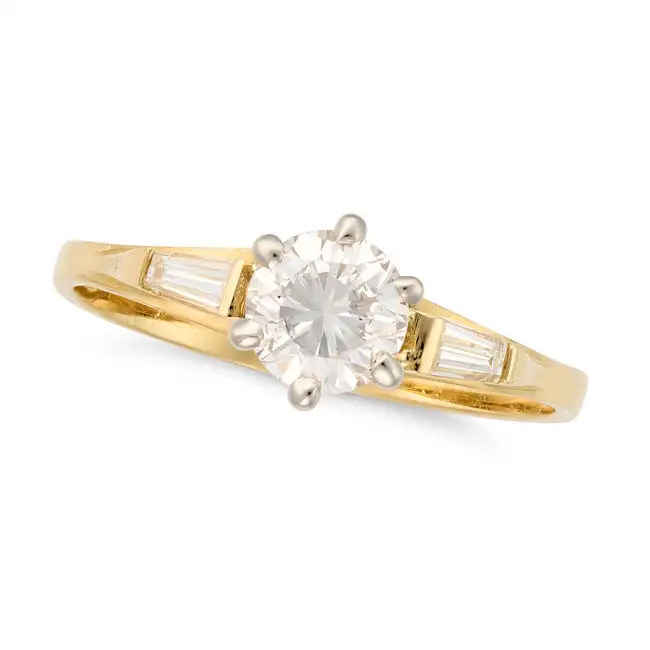 A SOLITAIRE DIAMOND ENGAGEMENT RING in 18ct yellow gold, set with a round brilliant cut diamond of