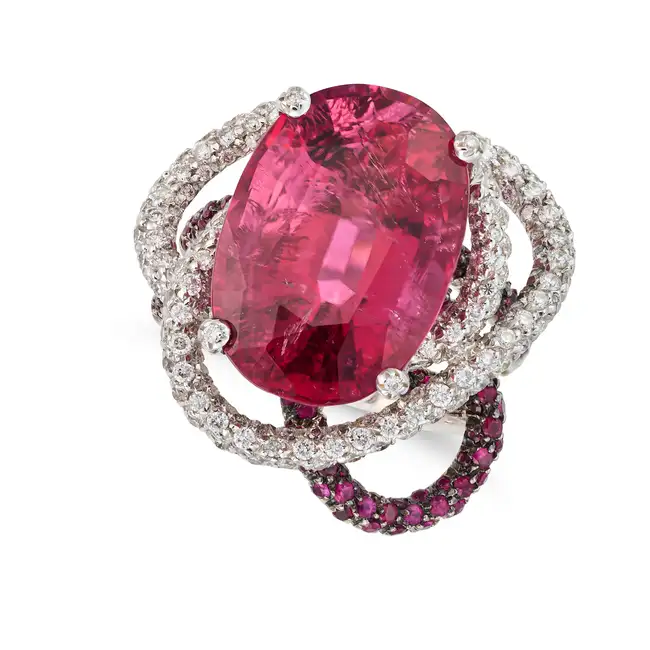 A PINK TOURMALINE, DIAMOND AND RUBY RING set with an oval cut pink tourmaline of approximately 15.18