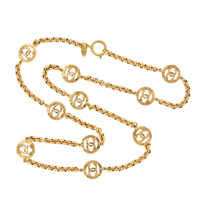 CHANEL, A CC MEDALLION NECKLACE comprising a curb link necklace with ten interlocking CC medallion