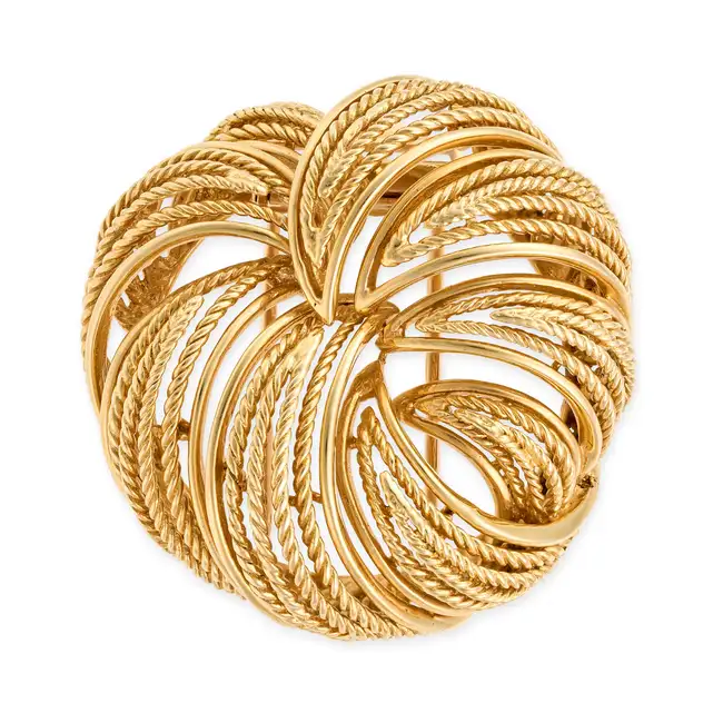 CARTIER, A VINTAGE GOLD BROOCH in 18ct yellow gold, the stylised brooch comprising segments of