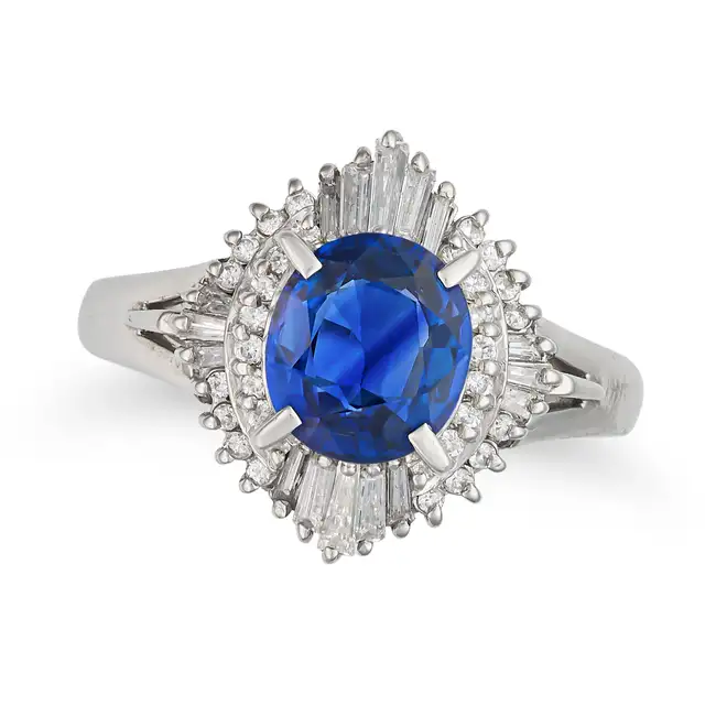 A SAPPHIRE AND DIAMOND BALLERINA RING set with an oval cut sapphire of approximately 1.98 carats,