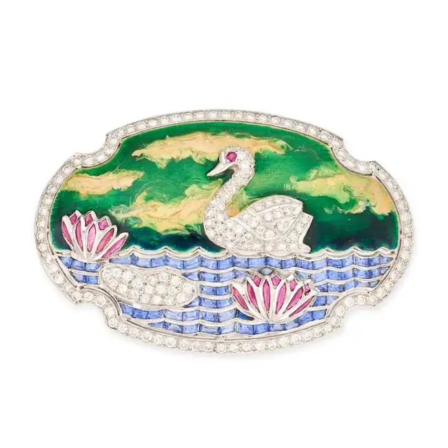 A DIAMOND, ENAMEL, SAPPHIRE AND RUBY SWAN BROOCH designed as a swan swimming in a pond with water