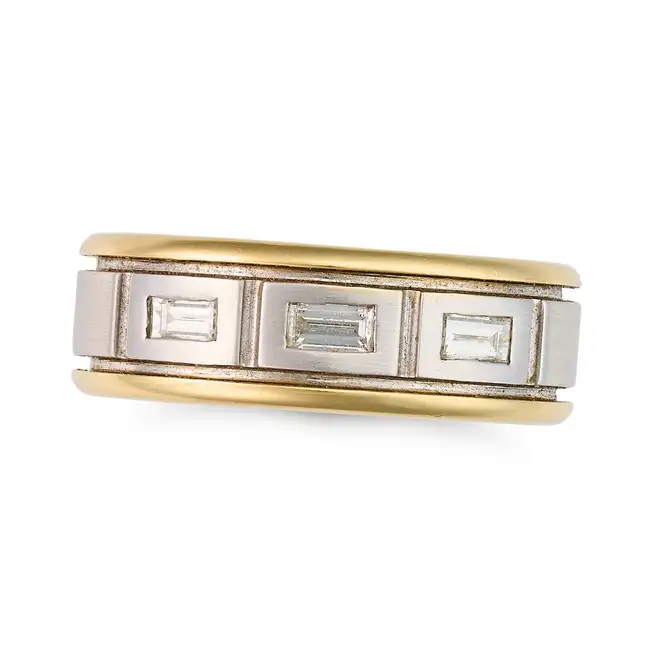 A DIAMOND BAND RING in 18ct white and yellow gold, the wide band set with three baguette cut