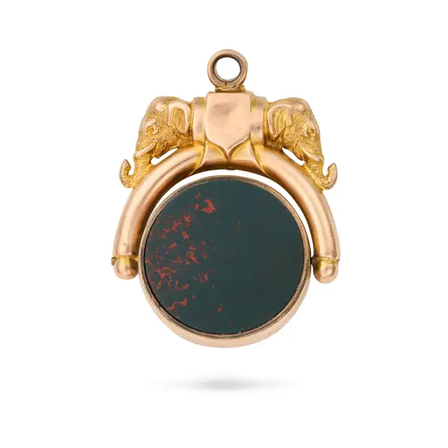 NO RESERVE - AN ANTIQUE BLOODSTONE AND SARDONYX SWIVEL FOB in yellow gold, the handle designed as