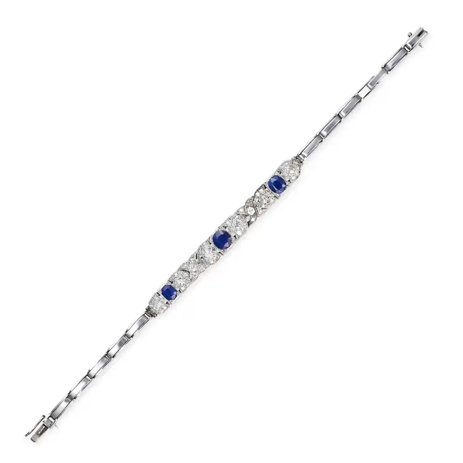 AN ANTIQUE SAPPHIRE AND DIAMOND BRACELET, EARLY 20TH CENTURY the central panel set with three