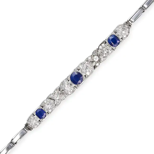 AN ANTIQUE SAPPHIRE AND DIAMOND BRACELET, EARLY 20TH CENTURY the central panel set with three