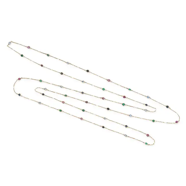 NO RESERVE - A MULTI GEM CHAIN NECKLACE comprising a trace chain set with round cut rubies,