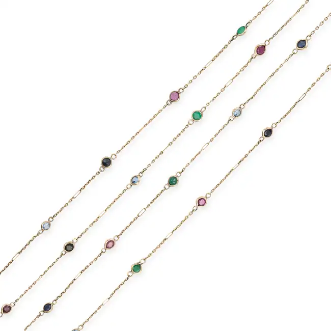 NO RESERVE - A MULTI GEM CHAIN NECKLACE comprising a trace chain set with round cut rubies,