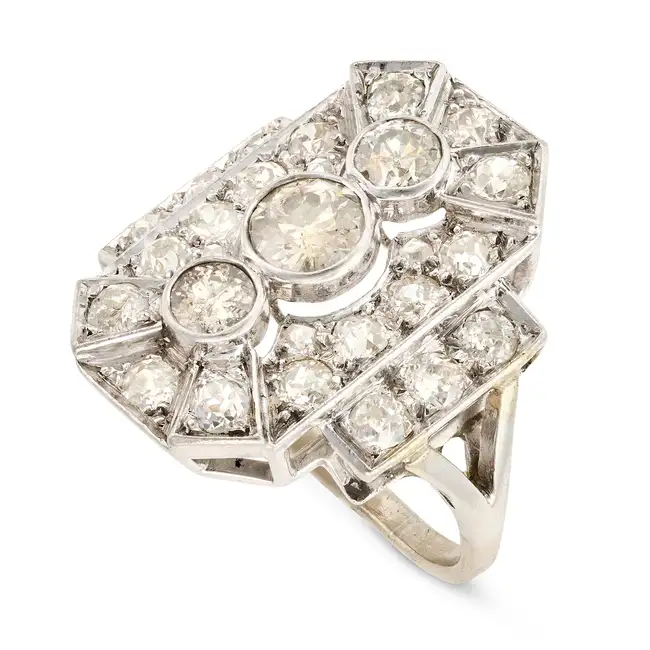 AN ART DECO DIAMOND DRESS RING the geometric ring set with three principal old European cut