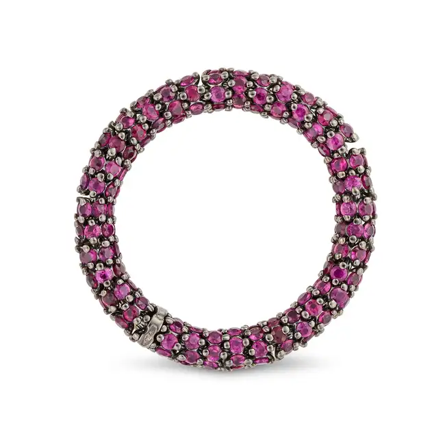 DEMEGLIO, A RUBY FULL ETERNITY RING in 18ct gold, pave set all around with round cut rubies