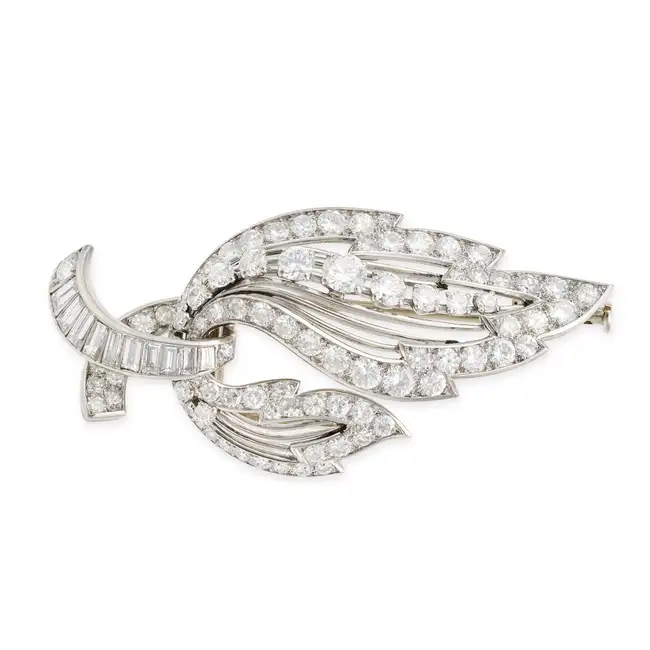 MAUBOUSSIN, A DIAMOND LEAF CLIP BROOCH in 18ct white gold and platinum, designed as a stylised