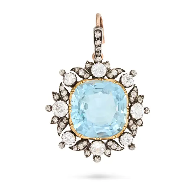 A FINE ANTIQUE AQUAMARINE AND DIAMOND PENDANT / BROOCH in yellow gold and silver, set with a cushion