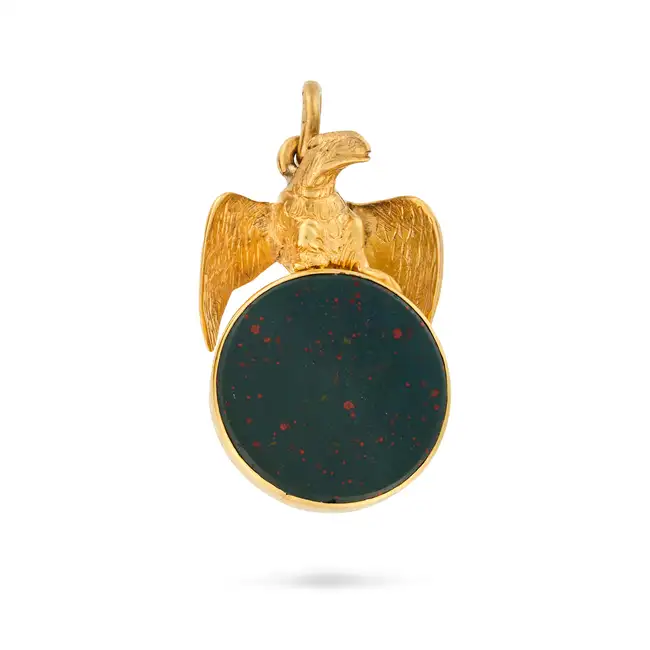 AN ANTIQUE VICTORIAN BLOODSTONE EAGLE SEAL PENDANT in yellow gold, designed as an eagle grasping a