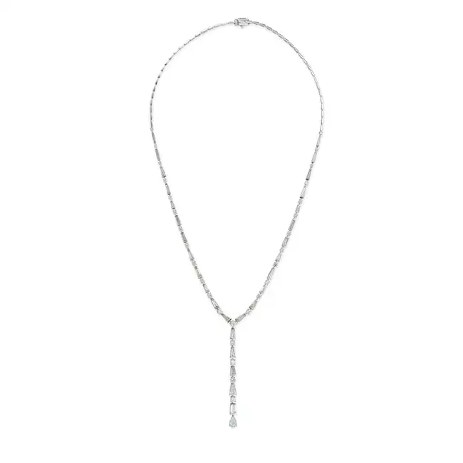 A FINE DIAMOND LARIAT NECKLACE set with a row of alternating and graduating round brilliant and